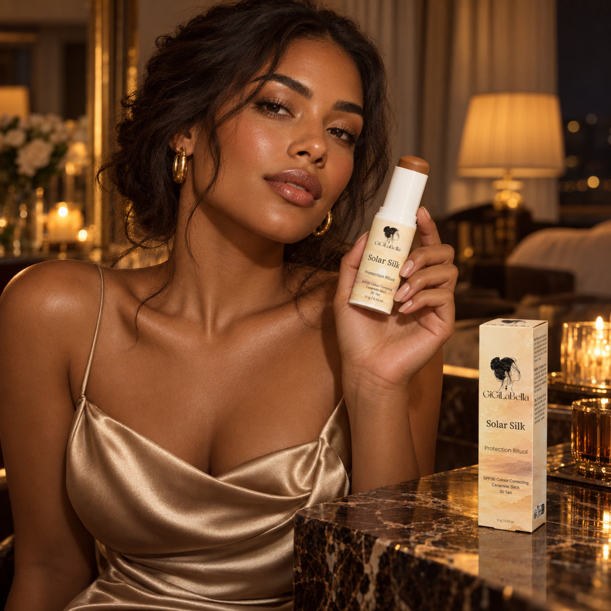 Woman in champagne satin holding GiGiLaBella Solar Silk 30 Tan in a warm evening setting