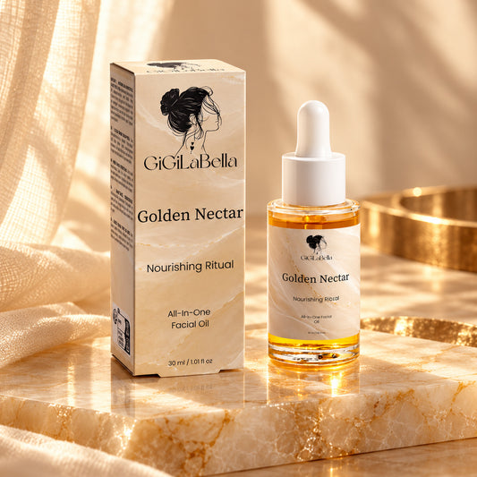 GiGiLaBella Golden Nectar facial oil bottle and matching cream-gold carton on alabaster