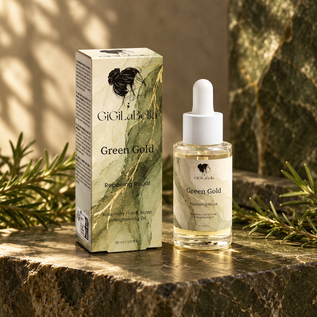 GiGiLaBella Green Gold rosemary hair and scalp oil bottle and green marble carton on olive stone with rosemary